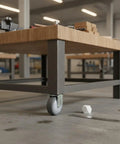 Heavy Duty TPR Plate Caster Wheel for Workspaces and Garages on metal table, smooth rolling, nonmarking floor friendly