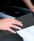 Dope 45 Sheet Wet Dry Sandpaper Set Ranging 120 To 5000 Grit for polishing auto surfaces and smoothing wood, showing usage.