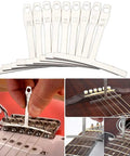 Guitar Repair Kit with pro-grade string action ruler gauge measuring tools and understring radius gauges in use.