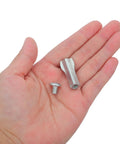 Hand holding two pieces from Eight Piece Hacksaw Bolt And Wing Nut Set For DIY Repairs Tough Pro Grade Hardware Kit