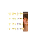 8 Pair Hypoallergenic Earring Set For Babies To Teens, Nickel Free Titanium And 14K Gold Plated Screw Back Studs, Flat Back Comfort For Sensitive Ears, Cute Flower Heart Star Ball Dot Mouse Designs, Baby First Jewelry. 8 pairs of gold stud earrings displayed beside a child ear
