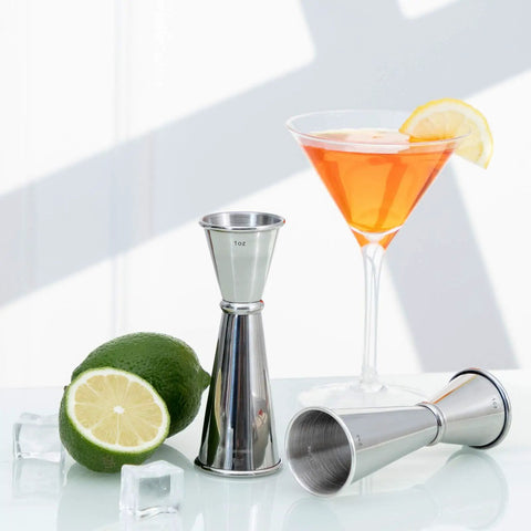 Double Head Cocktail Jigger For Bartending With Inside Measurements Japanese Grade 304 Stainless Steel Barware 1 Oz And 2 Oz shown with lime and cocktail