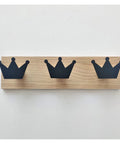 Super Slick Wall Mounted Coat Hooks Featuring A Dope Car Crown Design For Kids Rooms And Nurseries Hangs Lightweight Jacket Scarf Towel Bag And Robe For Zero Stress Home Organization, black crown hooks on a wooden mount.