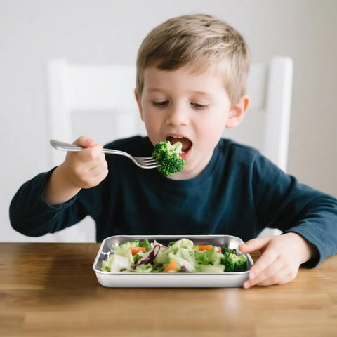 Child eating from Six Pack Stainless Steel Plates For Everyday Dining 9.2 Inch By 7 Inch Dimensions Food Grade Non Toxic Lead Free
