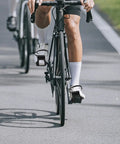 Cyclist using 2 Pack Toe Clip Pedals With Straps For Road And Commuter Bikes, Adjustable Foot Cages Fit Most Adult Bicycles