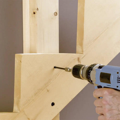Person using drill to insert 4 Inch Timber Framing Nails 250 Count Pro Grade Heavy Duty ACQ Safe And Corrosion Resistant