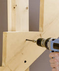 Using TimberLOK Heavy Duty Wood Screw 6 Inch 250 Count Black on wooden beams, showcasing tapered head countersinking easily