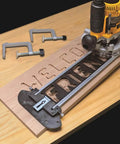 Knockout Sign Making Kit For Router Stencils with half inch templates carving 'WELCOME FRIEND' on wood.