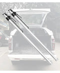 Heavy Duty Adjustable Cargo Bar For Pickup Truck And Trailer Ratcheting Tie Down 440 Lb shown in a truck bed with no skid rubber pads.