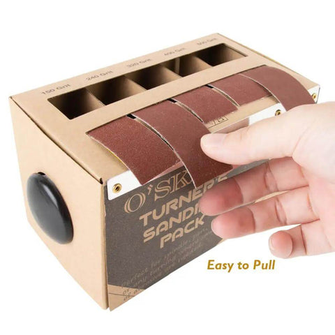 Hand pulling sanding strip from Sanding Strip Kit With Dispenser, 5 Grit Range 150 240 320 400 600 Rolls For Woodturners.