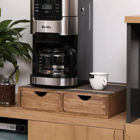 Dark wood Coffee Pods Storage Drawer Organizer with two drawers under coffee maker on a countertop.
