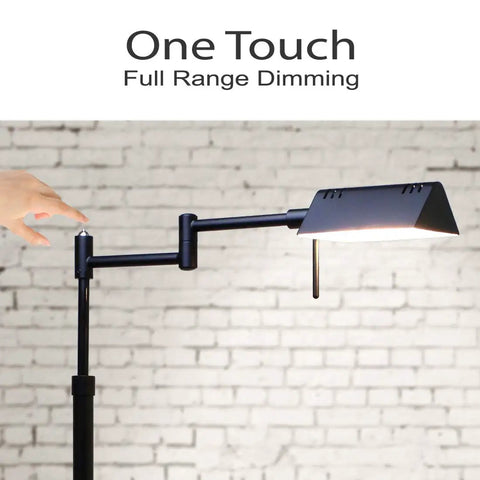 Dimmable LED Pharmacy Floor Lamp With Full Range Dimming And 360 Degree Swing Arms, Adjustable Height Standing Lamp For Reading Sewing And Crafty Projects, ETL Listed Black showcasing its one-touch dimming feature against a white brick wall.