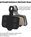 Close-up of copper semi-metallic mountain bike disc brake pads for hydraulic brakes, highlighting the stainless steel backplane.