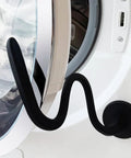 Magnetic Front Load Washer Door Prop and Holder with Strong Magnet and Flexible Hose on white washer, sleek black design.