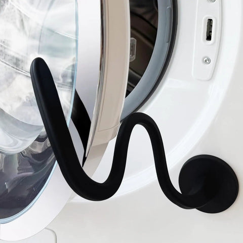 Magnetic Front Load Washer Door Prop and Holder with Strong Magnet and Flexible Hose on white washer, sleek black design.