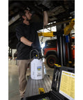 Mechanic using Pro Grade Hydraulic Brake And Clutch Pressure Bleeding System DIY Friendly With 1.2 Gallon Reservoir