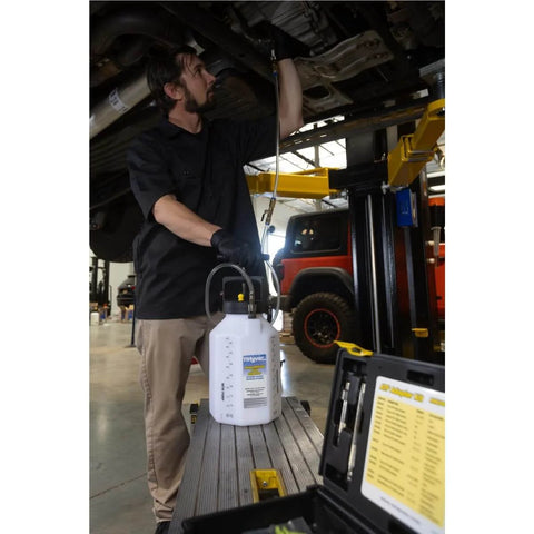 Mechanic using Pro Grade Hydraulic Brake And Clutch Pressure Bleeding System DIY Friendly With 1.2 Gallon Reservoir