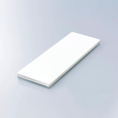 Glass Stone 6000 Grit Sharpener with ceramic slow wear media on smooth surface, model WA 50503 for precision honing.