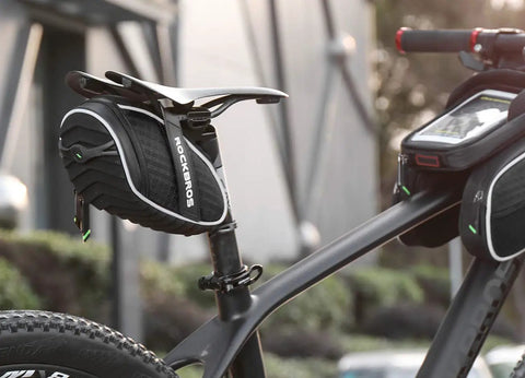 Under-Seat Bike Seat Bag, 3D Shell Saddle Pack with waterproof zipper, shock-resistant cushion, on a mountain bike.