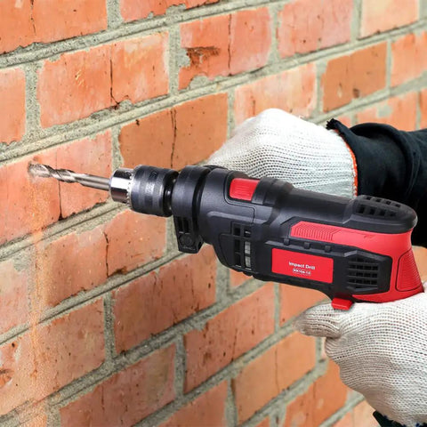 Person using 850W Corded Hammer Drill With 1/2 Inch Chuck, 2-in-1 Hammer And Drill For Steel, Concrete, Wood And Plastic on brick wall