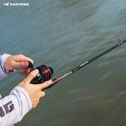 Angler holding Twin Tip Spin Cast Fishing Combo 6 Foot 6 Inch Medium Action Rod Two Piece With Extra Tip And Size 30 Reel fishing on water