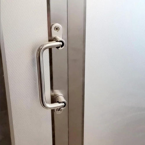 304 Stainless Steel Folding Pull Handle 90 Degree Door And Cabinet Pull Handle installed on door, 7 inch total length.
