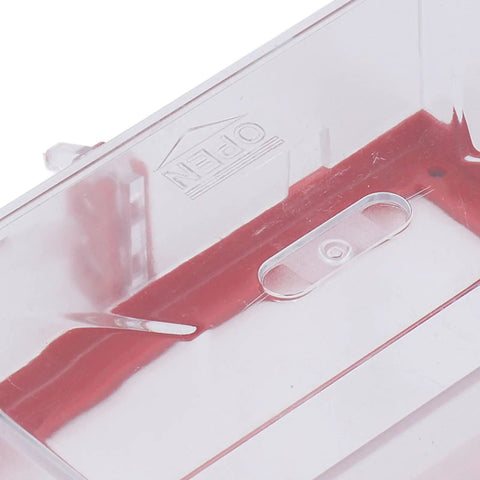 Close-up of Two Pack Emergency Stop Button Cover Kit showing transparent resin material and red internal locking mechanism.