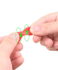 Set Of Four Silicone Auto Door Dampers Knock Out Heavy Slam Noise And Vibes With Grippy Hold, showcasing a person stretching a red silicone damper.