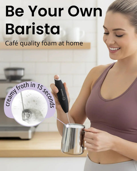 A person using a Handheld Drink Mixer With High Speed High Torque Motor Electric Stirrer And Protein Powder Wand Mini Frother For Quick Cocktails Milk Frother And Coffee Stirrers In Black Easy To Use Silky Foam In Seconds to froth milk.