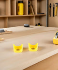 Yellow Emergency Stop Button Cover Kit For Control Panels And Push Button Switches With 22mm Mounting Hole High Visibility Waterproof Durable Plastic Protector To Prevent Accidental Presses, two yellow covers on workbench