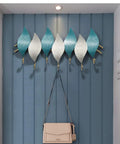 Heavy Duty Wall Mounted Coat Hook With Snowflake Design Iron Wall Hook For Entryway And Bathroom Rust Resistant Metal Hanger For Scarves Umbrellas Bags Keys And Hats Single Unit Silver Finish Home Decor Space Saver with a modern twist, showcasing blue and white hooks.