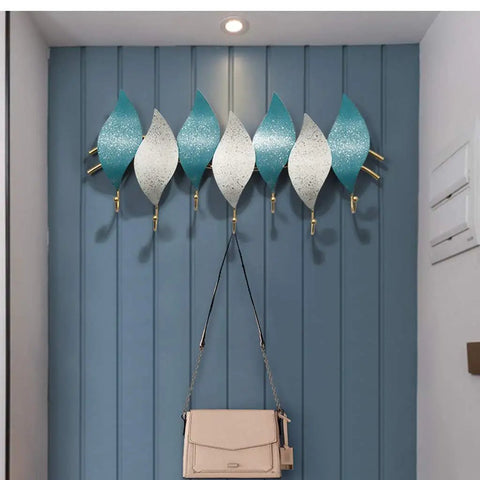 Heavy Duty Wall Mounted Coat Hook With Snowflake Design Iron Wall Hook For Entryway And Bathroom Rust Resistant Metal Hanger For Scarves Umbrellas Bags Keys And Hats Single Unit Silver Finish Home Decor Space Saver with a modern twist, showcasing blue and white hooks.