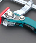 Close-up of a Beefy And Stable Bench Dog Hole Clamps For Woodworking Tables And Workbenches Steel Table Clamps with ratchet lock.