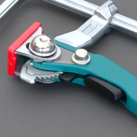 Close-up of a Beefy And Stable Bench Dog Hole Clamps For Woodworking Tables And Workbenches Steel Table Clamps with ratchet lock.