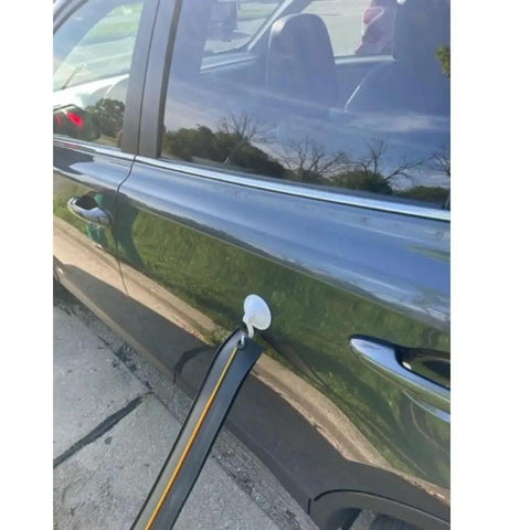 Flexible Race Car Track Set With Pressure Suction Cups attached to a car door