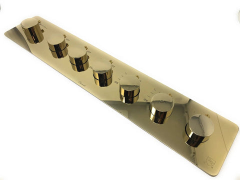 Kick Up Your Bathroom Goals With This Slick Ceiling Mount Rain Shower System Featuring Bright LED Lighting Smart Thermostatic Control And Polished Gold Hardware - polished gold thermostatic control plate with six knobs.