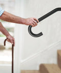 Close-up of Tough As Nails Wall Mount Hand Rails for 1 to 3 Steps Heavy Duty Grade Steel Safety Grab Bar supporting a user.