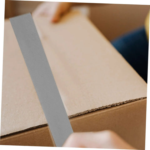 Applying Heavy Duty Duct Tape Sealing Tape for Indoor and Outdoor Use Quick Fix Pipe Leaks and Repairs Base Waterproof Cloth Tape You Can Tear by Hand Sticks Fast and Holds Tough for Household Garage and Outdoor Projects to a cardboard box