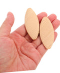 100 Piece Real Deal Hardwood Joiner Biscuits For Woodworking Board Jointing shown in hand, smooth edge and light yellow color.