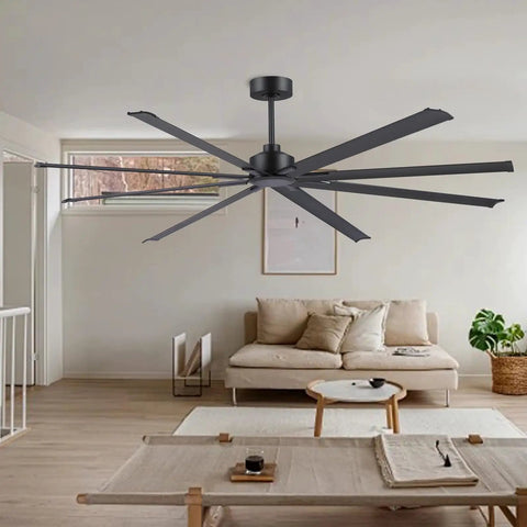 Badass 84 Inch Industrial Ceiling Fan With Reversible DC Motor And Eight Robust Blades Delivers Six Speed Remote Control Hella Quiet Airflow For Massive Garages And Shops In Matte Black in a modern living space.