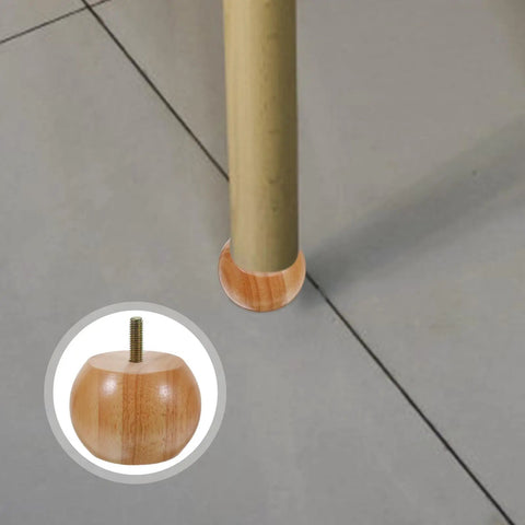 Bottom view of a table leg with unfinished round wood bun foot detail, 4 Pack Wood Round Furniture Legs Replacement Sofa Bun Feet For Tables Chairs Benches And Cabinets, Unfinished Wood Riser Feet That You Can Paint, Height Boost, Easy Install For DIY Home Furniture Makeover.