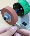 Five Piece Badass Corundum Buffing Wheel Set Featuring Three Inch Polishing Discs With Three Eighth Arbor Hole For Slick Metal Shine and Tough Surface Prep On Hard Materials in use on a drill bit.
