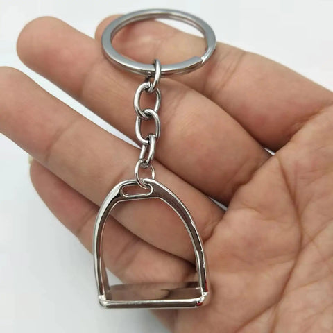 Elegant Stirrups and Snaffle Bit Key Rings D Shaped Keychain made from sturdy alloy in a hand for equestrians and horse lovers.