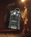 4XR Multigas Detector Portable Handheld Gas Monitor With LEL O2 H2S CO Sensing in a rugged underground tunnel.