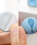 Close-up of 6 Pack Desk Cable Organizer Clips for Wire Management Adhesive Cord Holders in blue installed on desk edge.