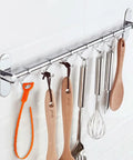 Kitchen tools hanging on rail with 4 Pack 25 Inch Drain Snake Kit For Clogged Drains And Drain Clog Remover Unclog Kitchen Sink Bathroom Tub.