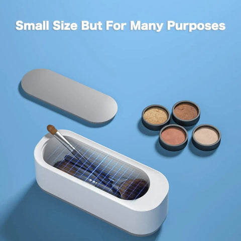 Ultrasonic Jewelry Cleaner Portable Pro Grade Household Cleaning Machine shown with makeup, lids off, on blue surface.