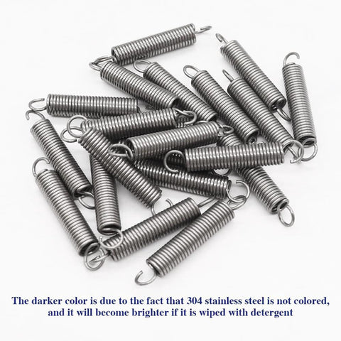 Pile of 20 SP9600 small stainless steel extension springs with hooked ends, 1/4 in x 1-1/2 in.