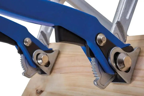 Heavy Duty Top Shelf 12 Inch Lever Clamp Packing 1100 Pounds Of Iron Grip Hold With Spindle Free Ratcheting Action and Ergonomic Handle for Fast Track Shop Projects, detailing the steel jaws gripping wood.