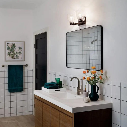 Bathroom with Fourteen And A Half Inch Two Light Vanity Light With Satin Etched Glass In Brushed Nickel over mirror.